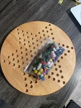 Wooden Chinese Checkers board and wooden colored pegs